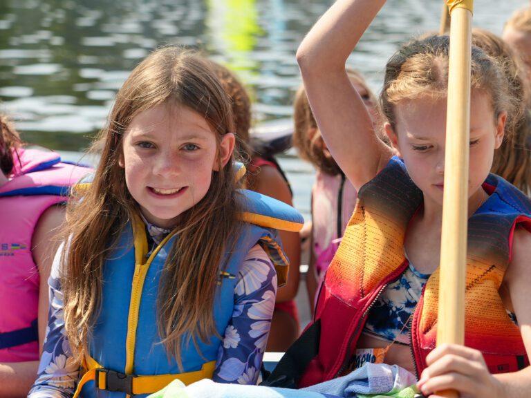 A group of young girls in a canoe